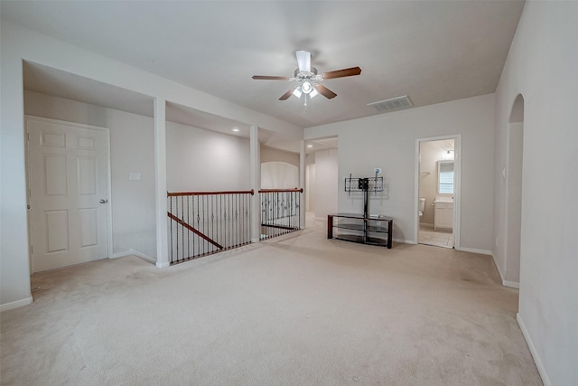 carpeted empty room with ceiling fan