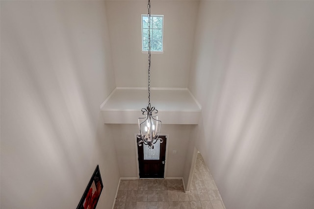 entryway with a notable chandelier