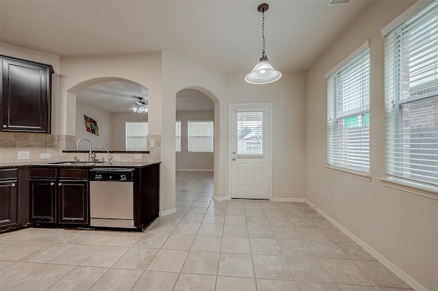 kitchen with dishwasher, backsplash, sink, hanging light fixtures, and ceiling fan