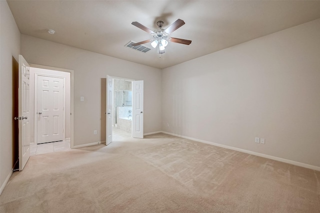 unfurnished bedroom with ceiling fan and light carpet