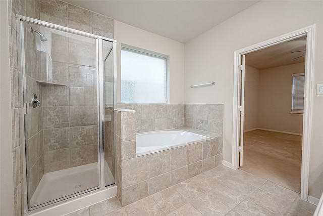 bathroom with shower with separate bathtub and tile patterned floors