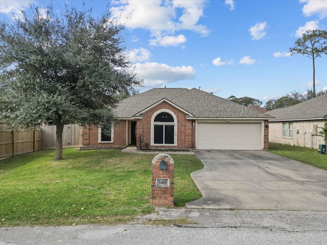 single story home featuring a front yard and a garage