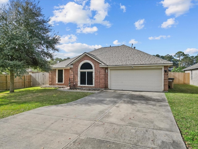 ranch-style home featuring a garage and a front yard