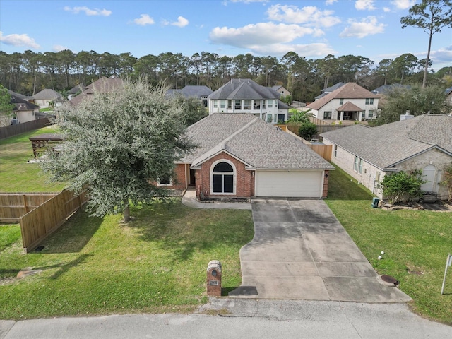 view of front of house featuring a front yard and a garage