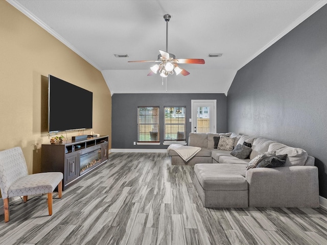 living room featuring hardwood / wood-style flooring, vaulted ceiling, and ceiling fan