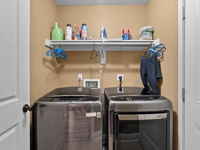 laundry room with washing machine and dryer