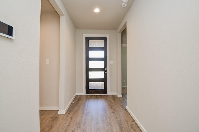 doorway with light hardwood / wood-style flooring