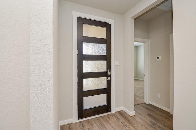 foyer entrance featuring hardwood / wood-style flooring