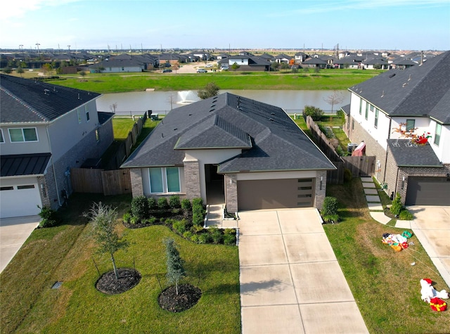 drone / aerial view featuring a water view