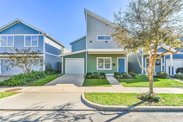 view of front of property featuring a garage and a front lawn