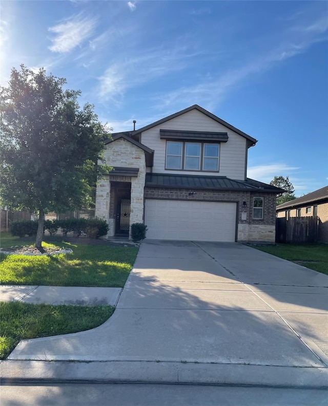 view of front facade featuring a front yard and a garage