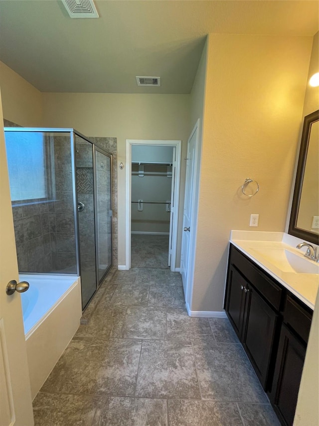 bathroom with separate shower and tub and vanity