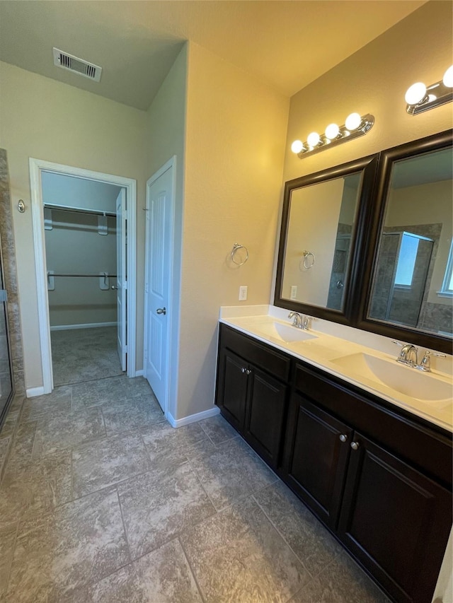 bathroom with vanity and an enclosed shower