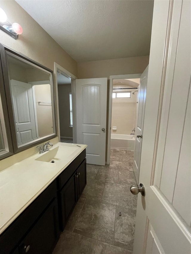 bathroom featuring vanity and a textured ceiling