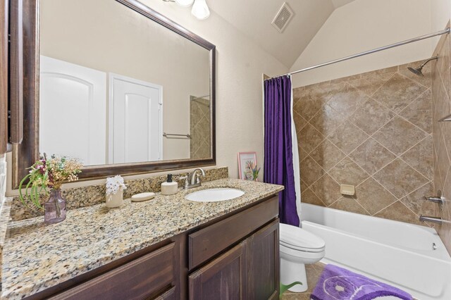 full bathroom with shower / tub combo with curtain, vanity, vaulted ceiling, and toilet