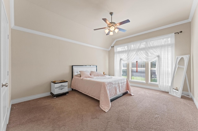 carpeted bedroom featuring ceiling fan, crown molding, and vaulted ceiling