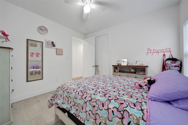 bedroom featuring ceiling fan and light hardwood / wood-style floors