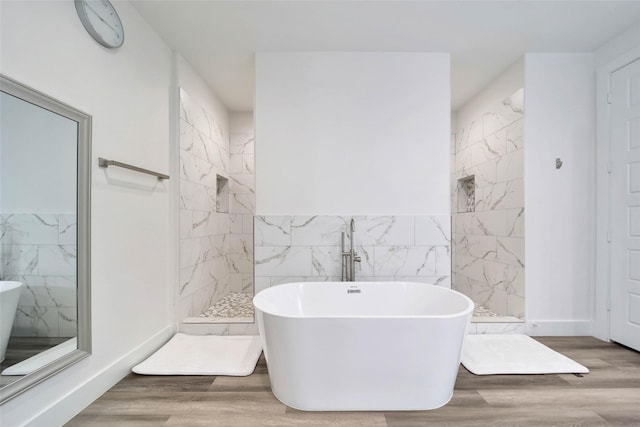 bathroom with hardwood / wood-style floors and plus walk in shower