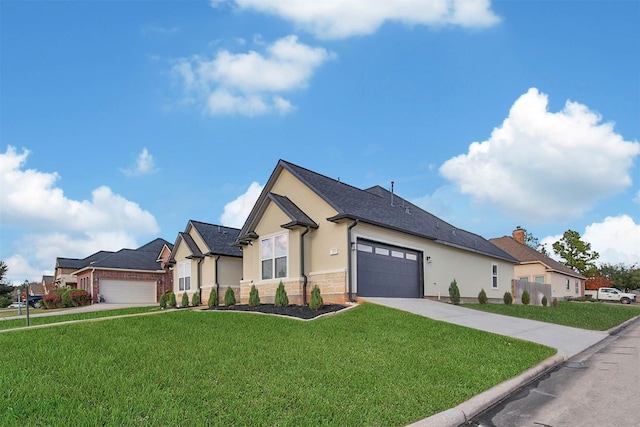 view of front of home featuring a garage and a front lawn