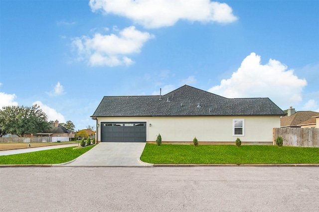 view of side of home with a yard and a garage