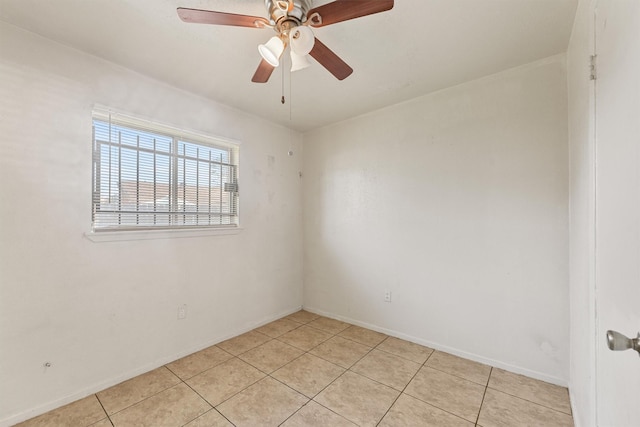 tiled empty room with ceiling fan