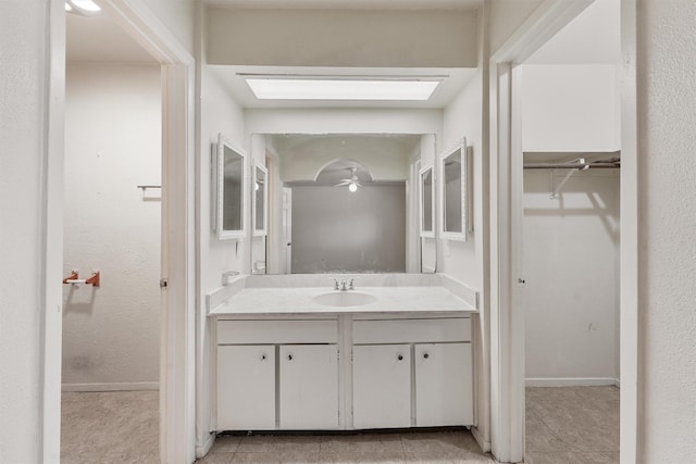 bathroom featuring vanity, tile patterned floors, and ceiling fan