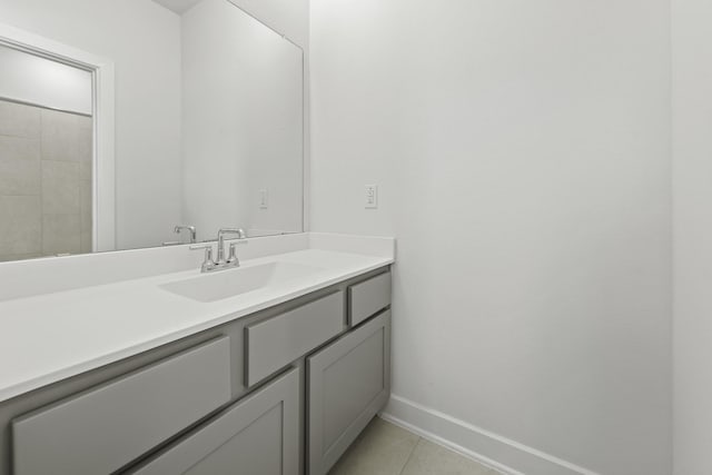 bathroom featuring tile patterned flooring and vanity