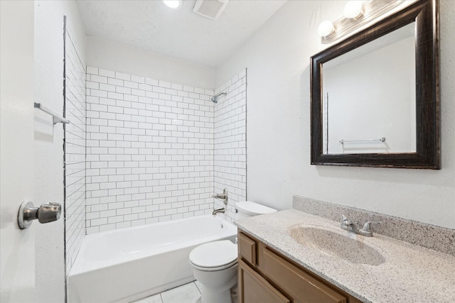 full bathroom with a textured ceiling, vanity, tiled shower / bath combo, tile patterned flooring, and toilet