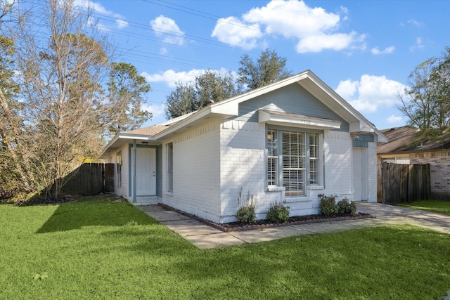 view of side of property with a yard