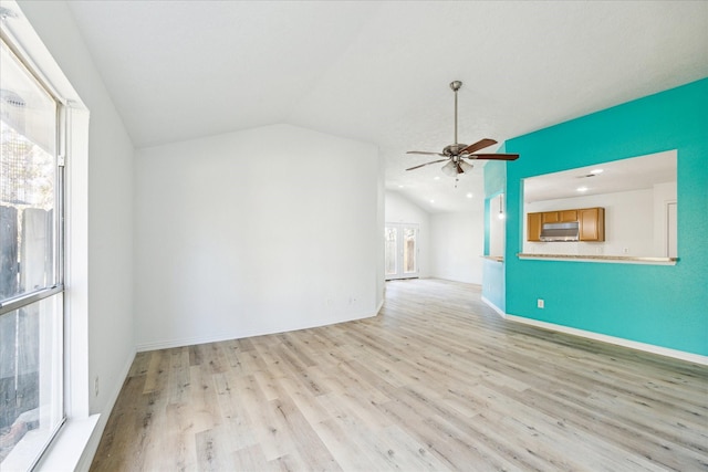 unfurnished living room featuring ceiling fan, light hardwood / wood-style flooring, and vaulted ceiling