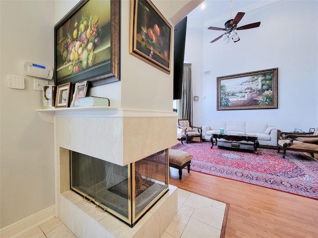 interior space with a high ceiling and light hardwood / wood-style floors