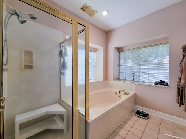 bathroom featuring tile patterned flooring and shower with separate bathtub