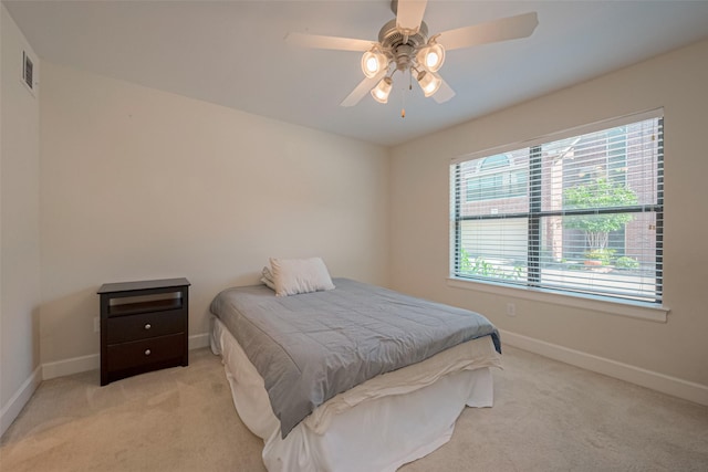 bedroom featuring ceiling fan and light colored carpet