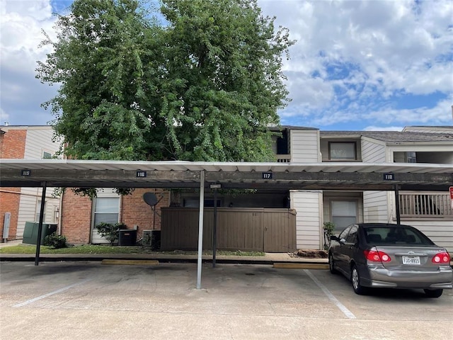 view of parking / parking lot with a carport