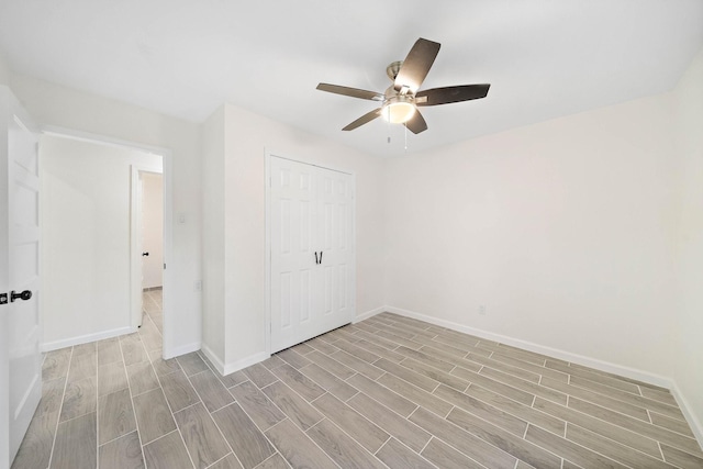 unfurnished room with ceiling fan and light wood-type flooring