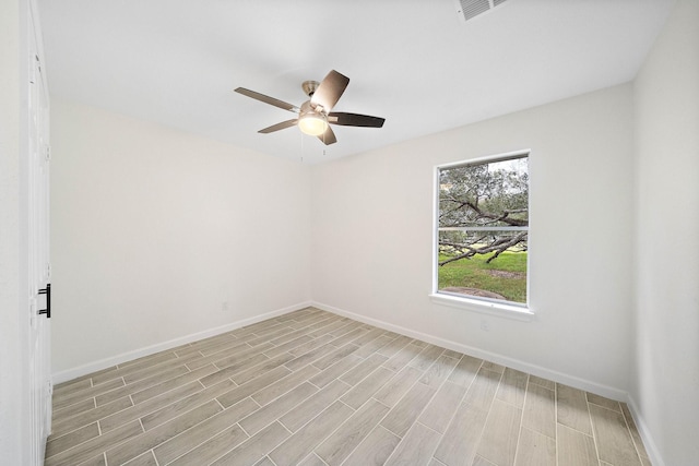 spare room featuring ceiling fan and light hardwood / wood-style floors