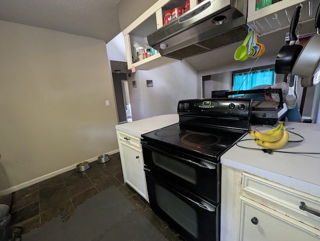 kitchen with black / electric stove, exhaust hood, and dark tile patterned flooring