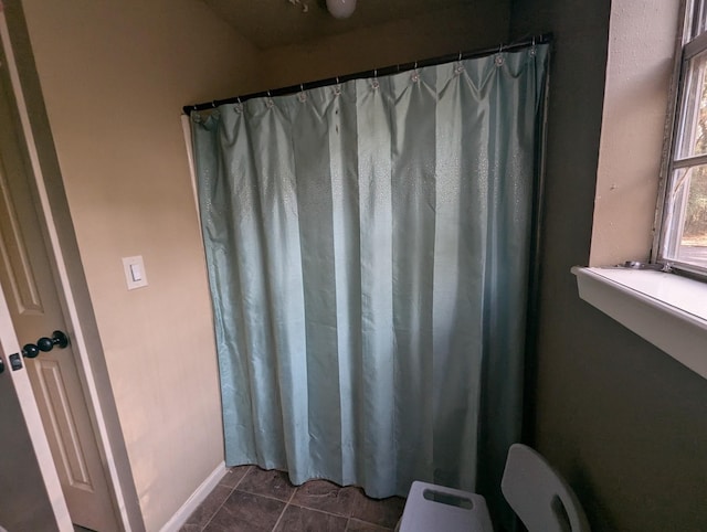 bathroom with tile patterned floors