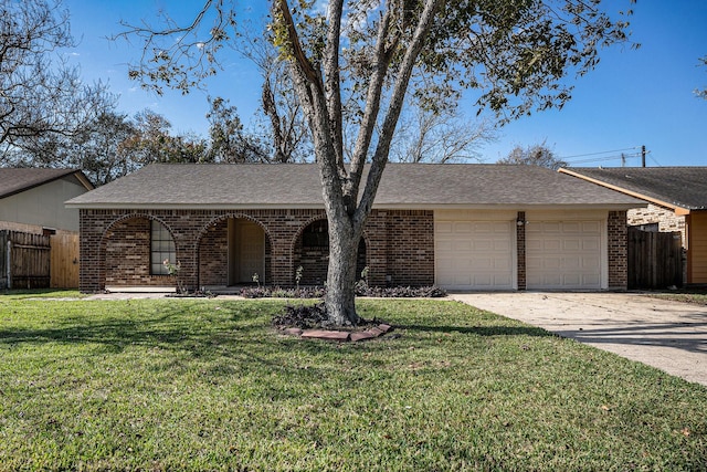 ranch-style home featuring a front yard and a garage