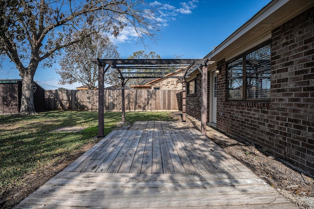 wooden terrace with a pergola and a lawn