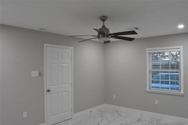 empty room featuring ceiling fan