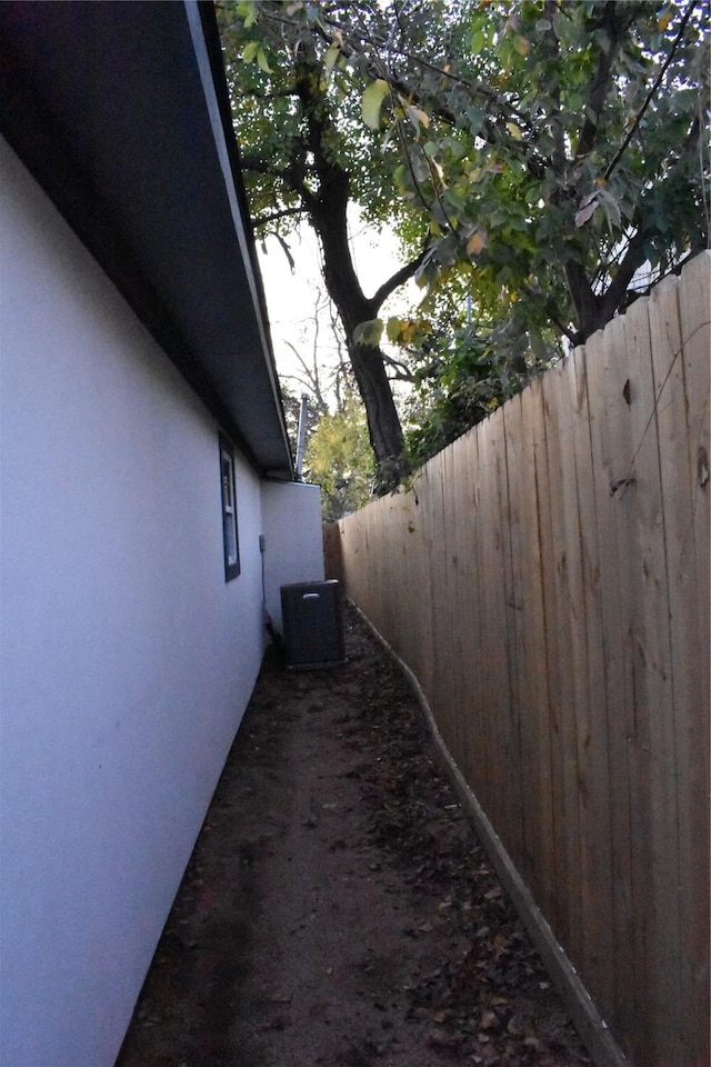 view of side of property featuring cooling unit