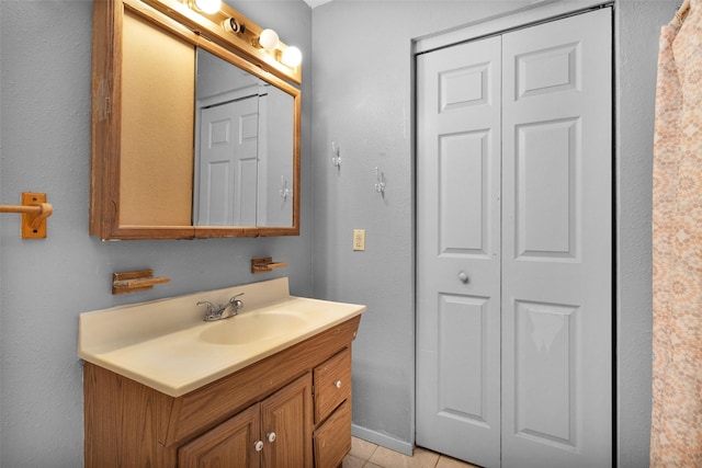 bathroom featuring tile patterned floors and vanity