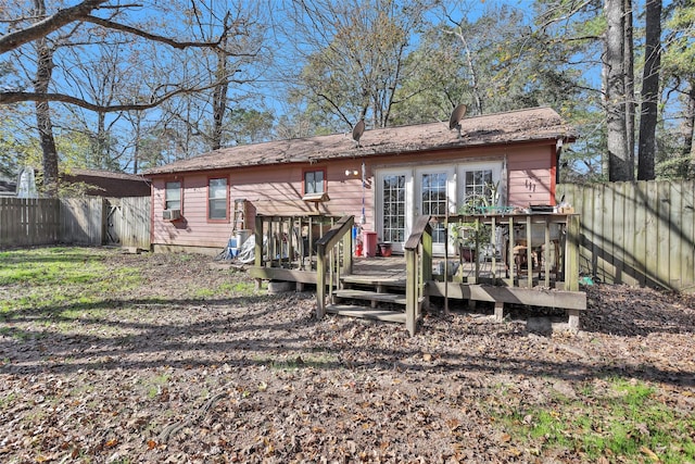 back of property featuring cooling unit and a wooden deck