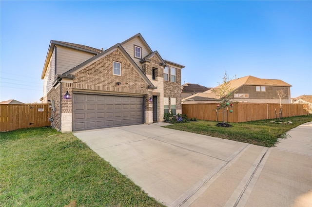 view of front of house with a front yard and a garage