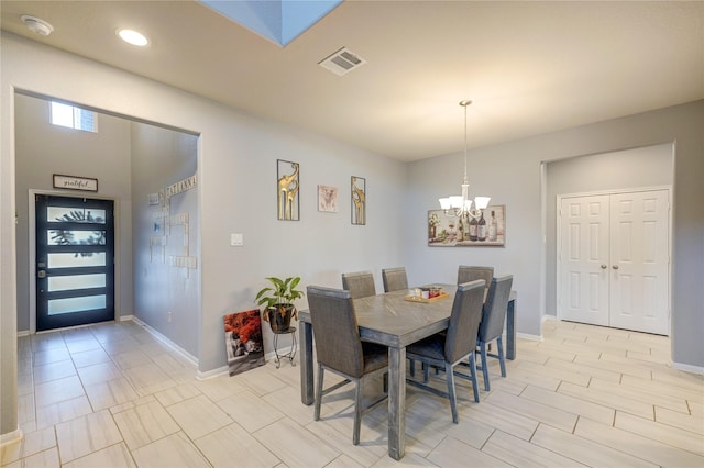 dining room with a notable chandelier