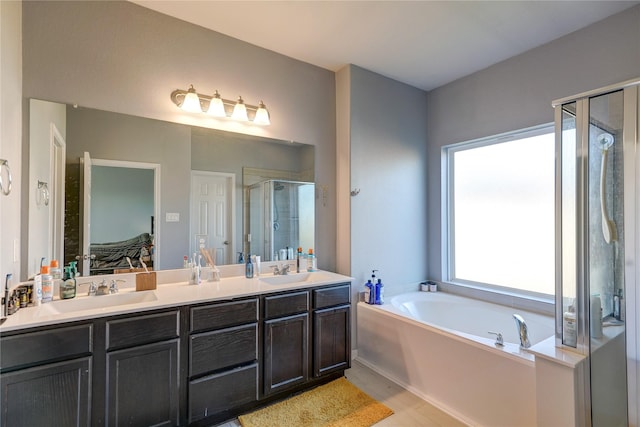 bathroom featuring hardwood / wood-style floors, vanity, and shower with separate bathtub