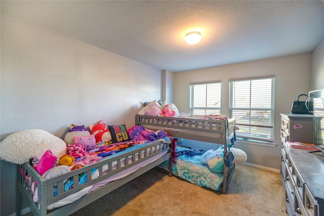 carpeted bedroom with a textured ceiling