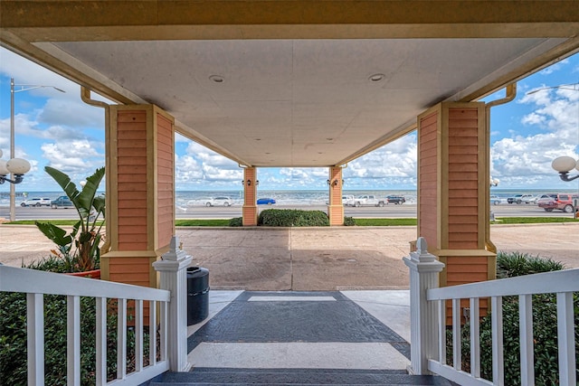 view of patio with a water view