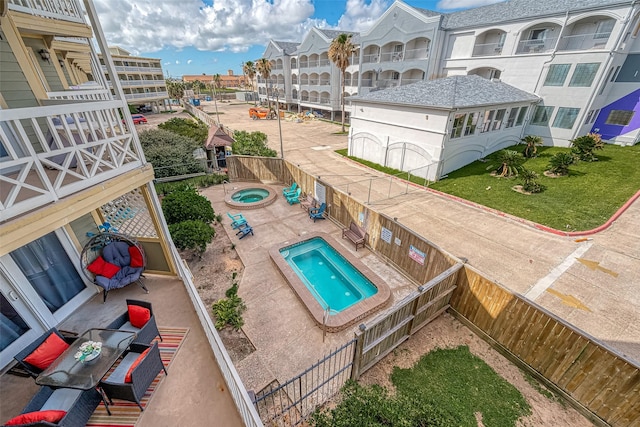 6300 Seawall Blvd Unit 3213, Galveston, TX 77551 - pool featuring a fenced backyard, a hot tub, and a patio